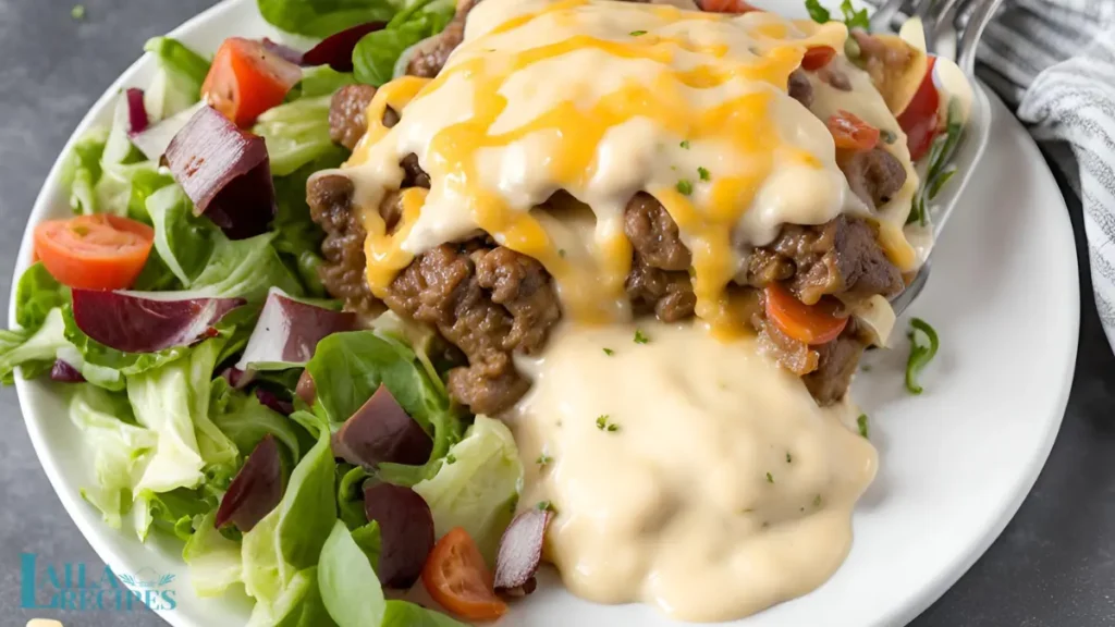 Skillet with ground beef and onions cooking over medium-high heat