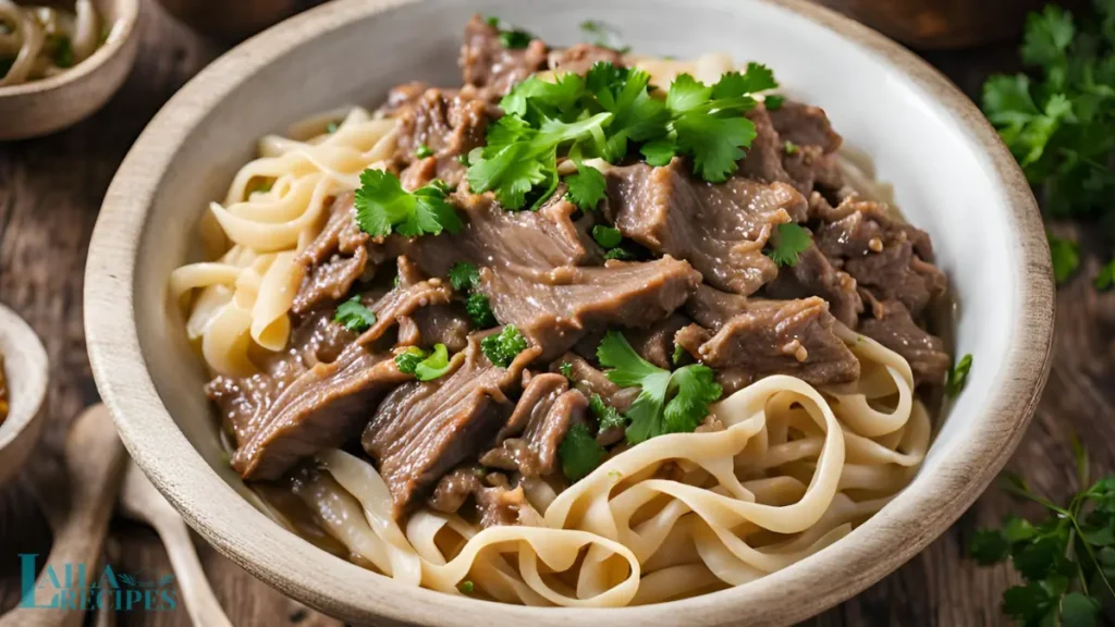 Ingredients for beef and noodles recipe arranged on a kitchen counter.