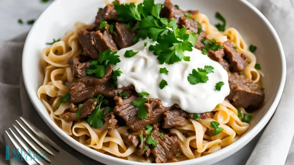 Tender chunks of beef searing in a skillet.