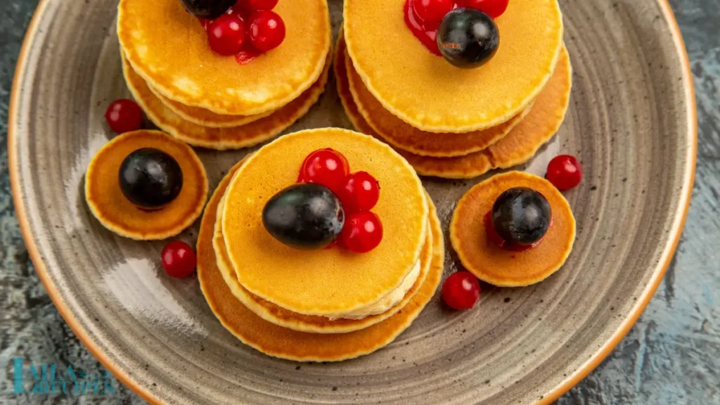 Savory mini pancakes topped with smoked salmon and cream cheese.
